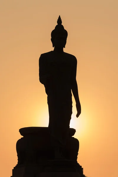 Silhouette Buddha with sun light background