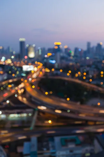 Blurred bokeh lights city and highway interchanged, abstract background