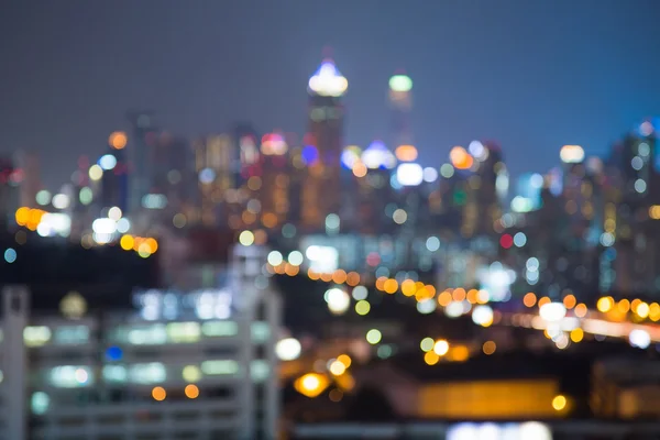 Blurred bokeh lights night view, city office building