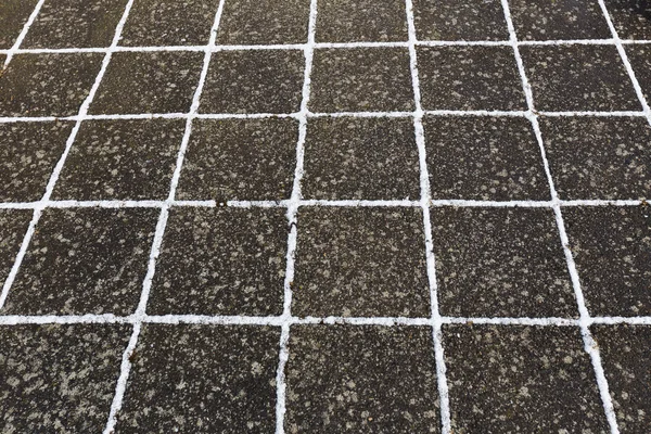 Close up of frosted stone footpath