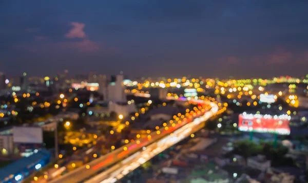 Busy hours of City road curved background at night, Abstract blurred bokeh