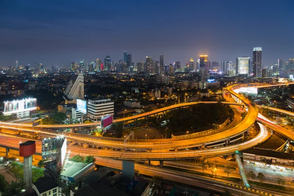 Aerial view of highway interchanged with city downtown