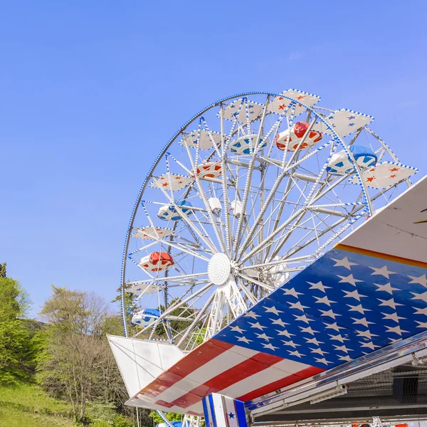 Ferris wheel on blue sky