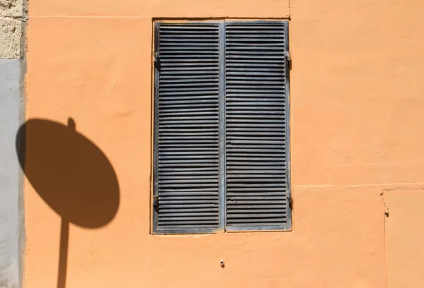 Window and a traffic sign shadow