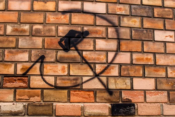 Hammer and sickle, graffiti on the bricks wall