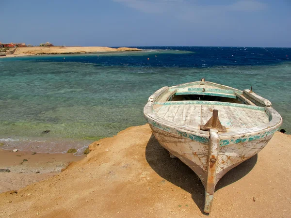 Old fising boat on the shore of Red Sea, Egypt