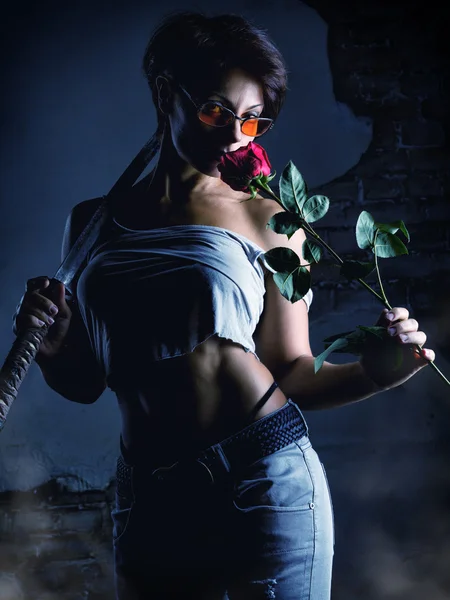 Beautiful woman fighter with a rose flower