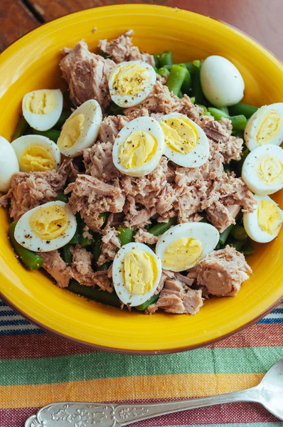 Salad with green beans, tuna and quail eggs