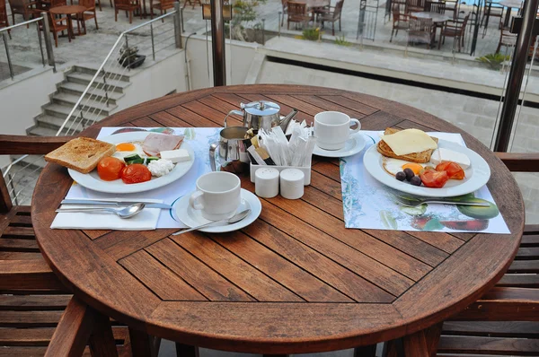 Summer breakfast for two in a cafe