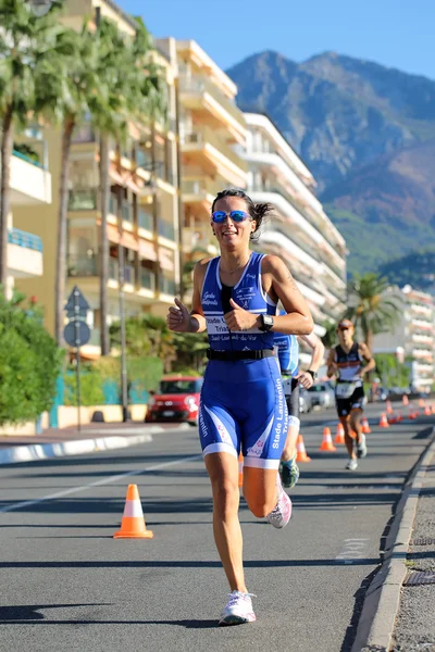 Woman runner in blue suit
