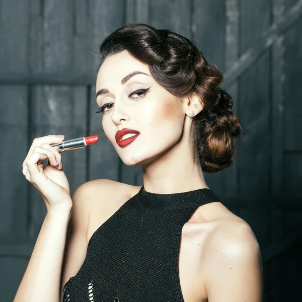 Young retro woman with lipgloss