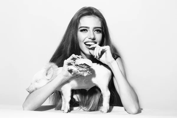 Woman with burger and pigglet