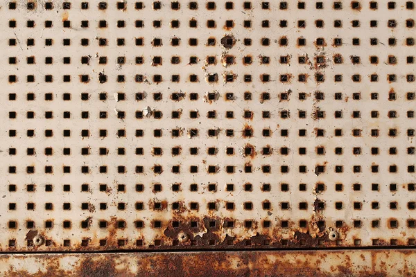 Metallic plate with square holes
