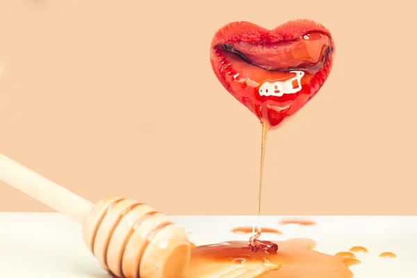 Female lips with honey