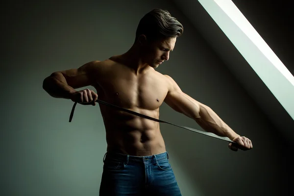 Muscular man with belt