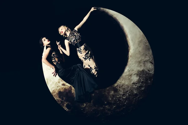 Women in dress on moon