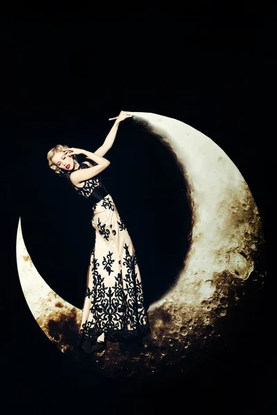 Woman in dress on moon