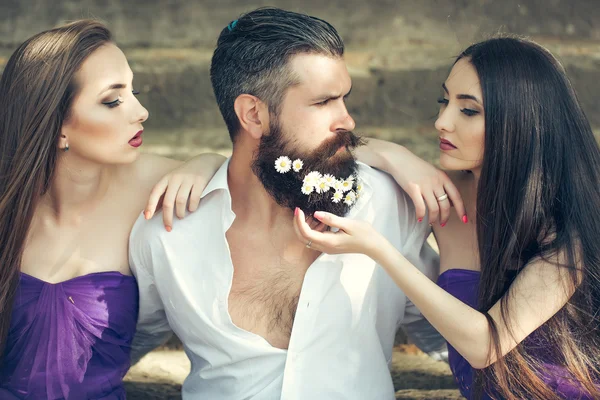 Bearded man and women on stairs