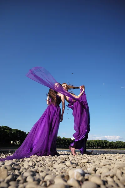 Women in violet dresses