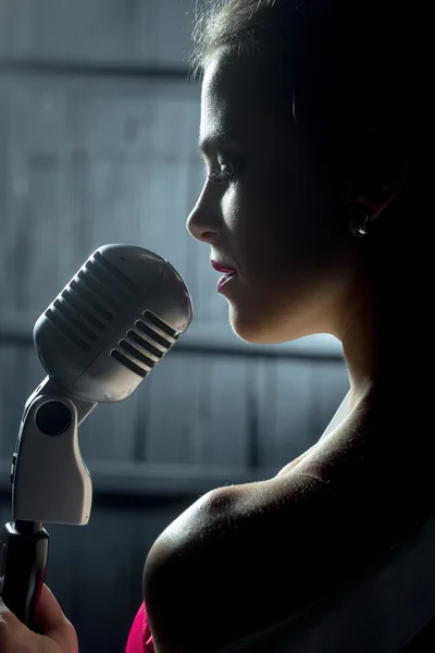 Sensual woman with microphone