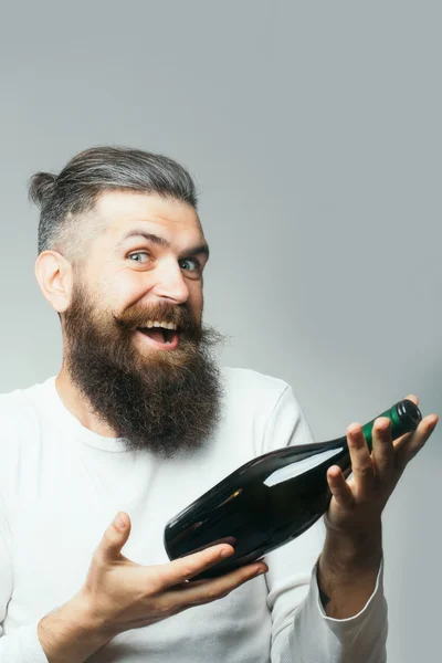 Bearded man with wine bottle