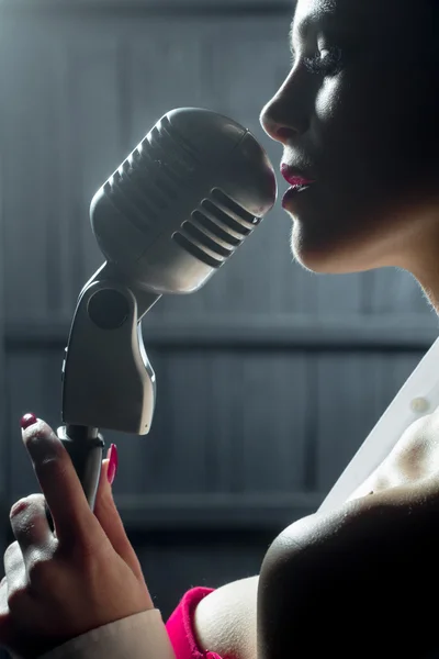 Sensual woman with microphone