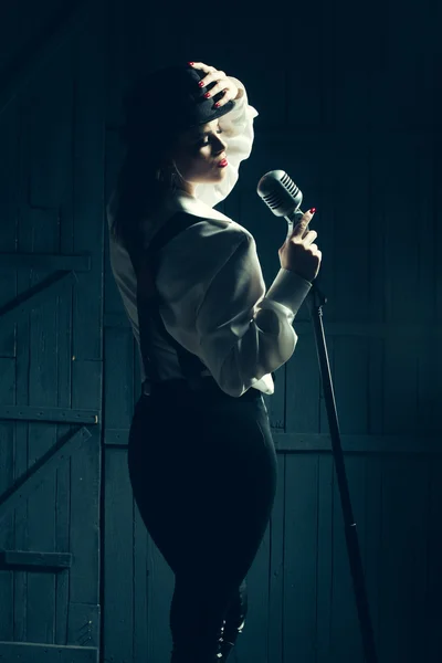 Retro woman with microphone