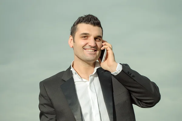 Businessman with phone outdoor