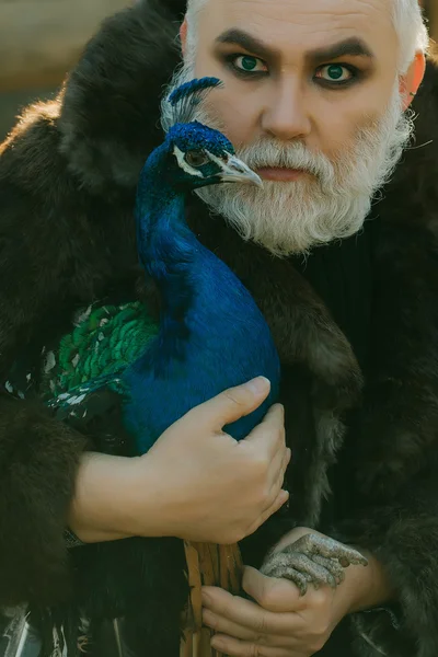 Bearded man with peacock