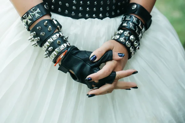 Female hands with leather bracelets