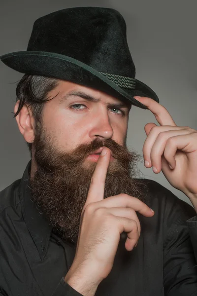 Bearded gentleman in black retro hat