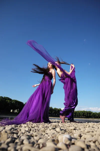 Women in violet dresses