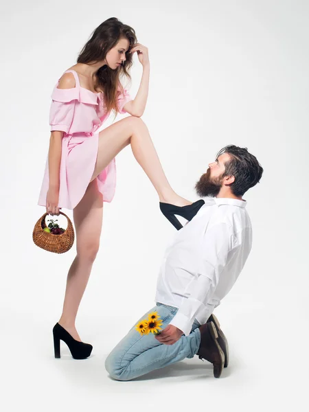 Young couple makes proposal with flowers isolated