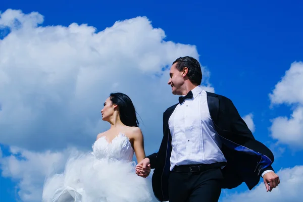 Wedding couple on blue sky