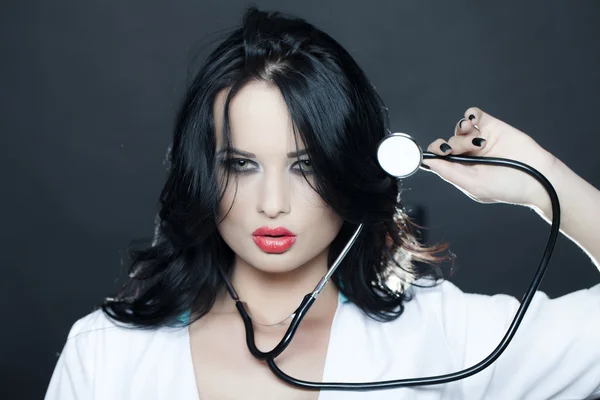 Pretty nurse with phonendoscope