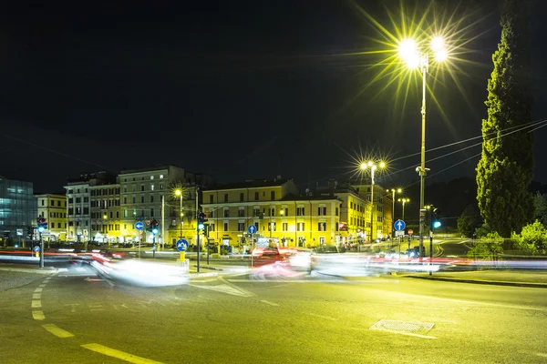 Illuminated night city and road