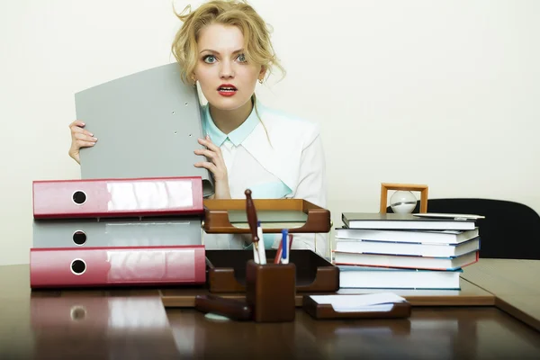 Blond woman at office table