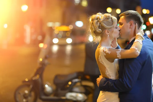 Wedding couple at night city street