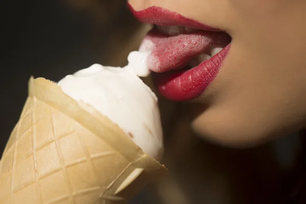 Female open mouth with ice cream