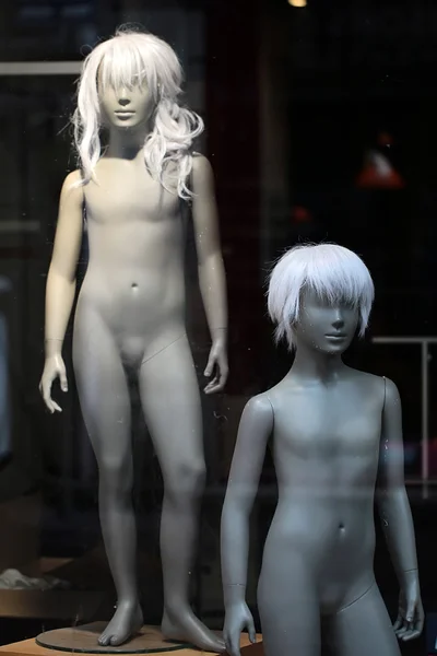 Pair of nude teenaged mannequins