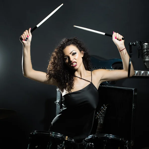 Woman playing drums
