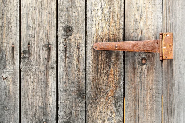 Butt on old wooden gate