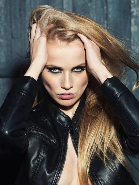 Sexual woman in leather jacket