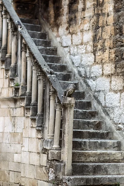 One grunge moldering masonry staircase
