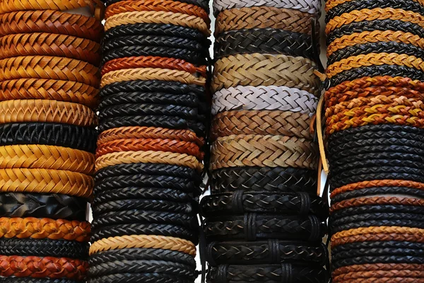 Braided leather belts stacked