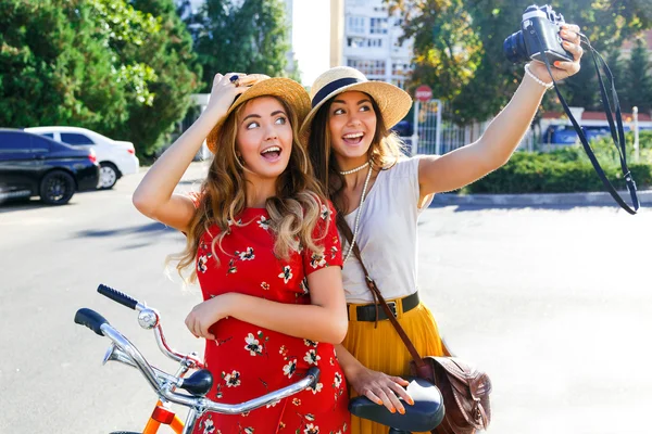 Two pretty girls taking selfie