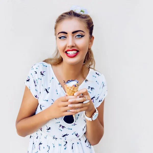 Pretty woman holding big ice cream