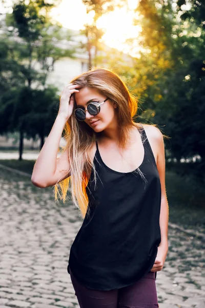 Pretty woman posing at the park