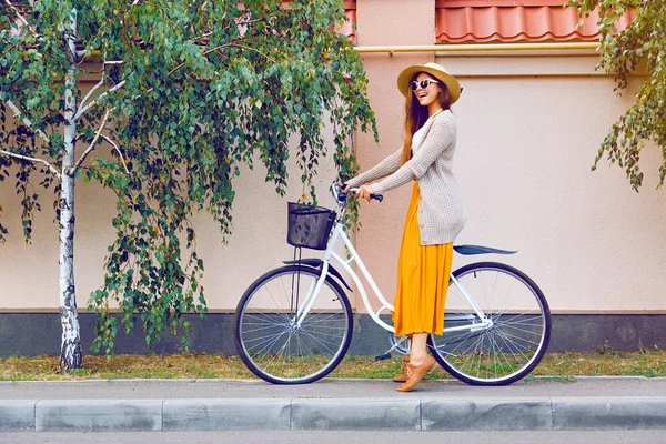Girl riding her hipster retro bike