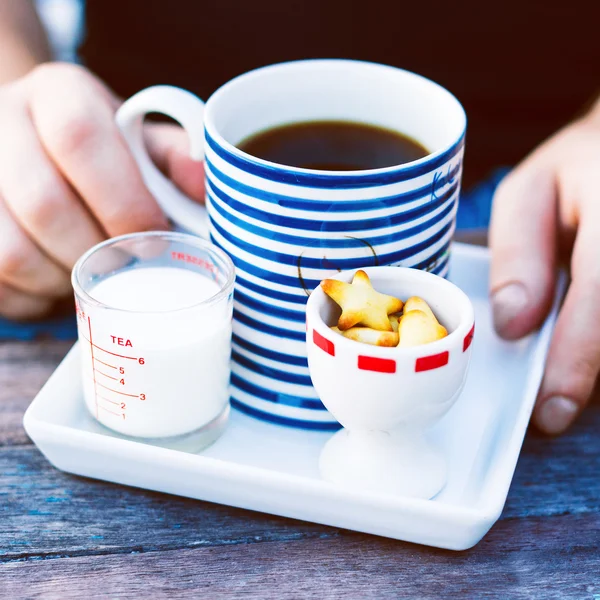 Man hands with morning cup of coffee